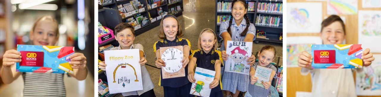 Five children smile and hold books they have created.