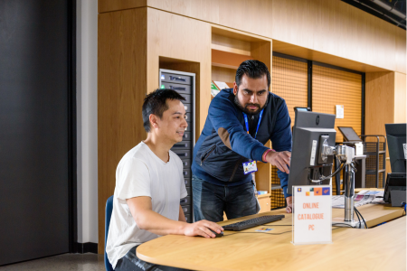 staff helping customer computer